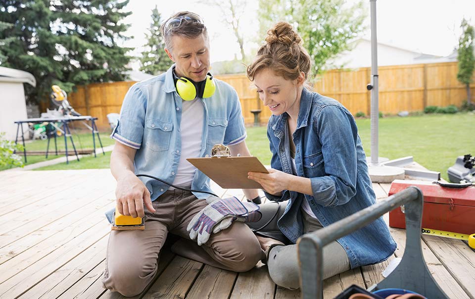 Man and Woman working on a new deck