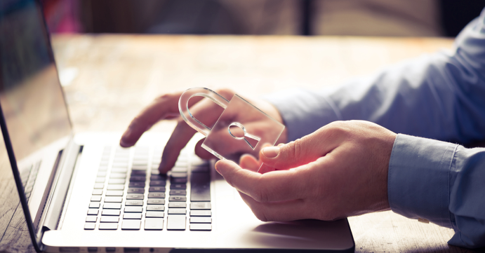 Person on Laptop with Transparent Lock