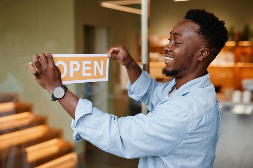 Man opening his store because he has a TEG Business Checking Account